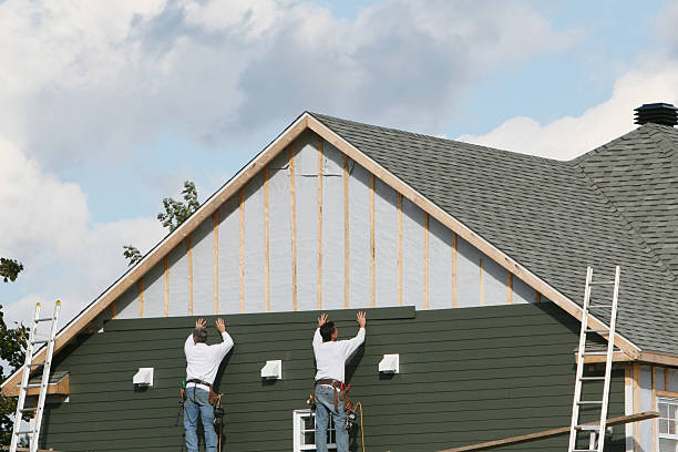 Professional Siding Installation technician working in Dublin, VA